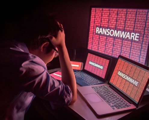 Image-of-a-person-stressed-at-a-computer-with-ransomware