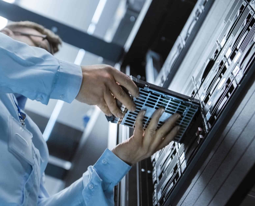 Worker-installing-hardware-in-a-data-center.