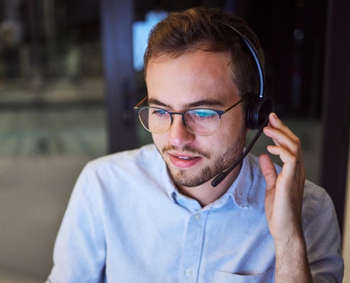 Front view of an IT professional talking on a headset