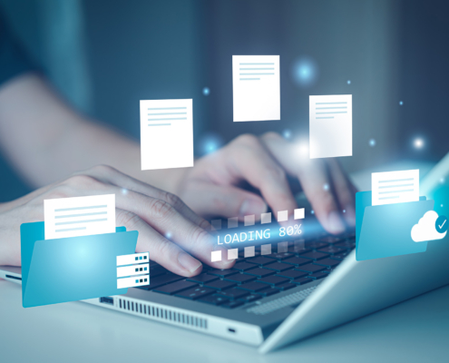 worker on laptop migrating to cloud