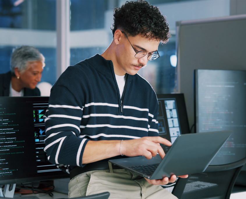 Man, programmer and office with laptop for coding