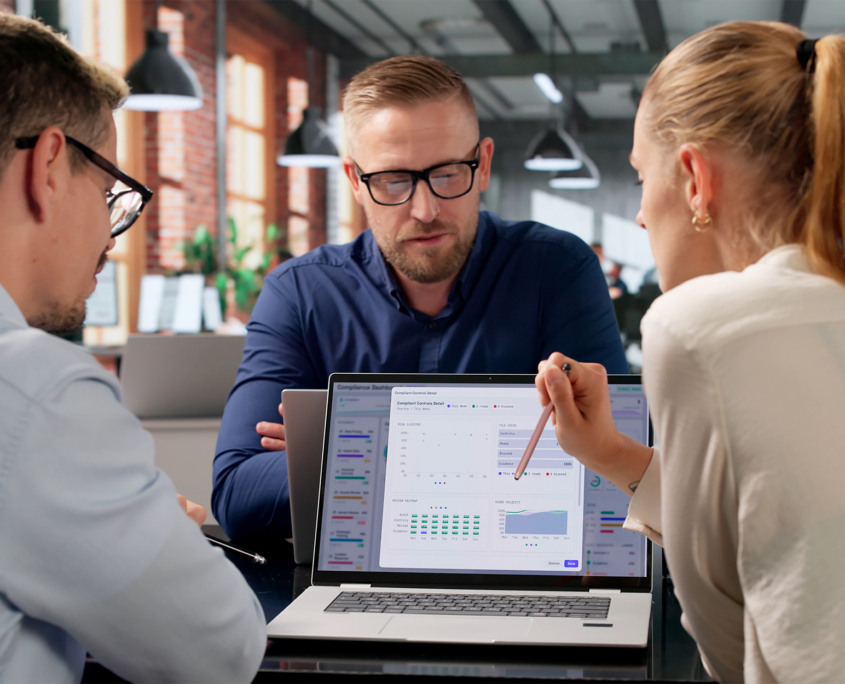 Compliance Manager Leads Diverse Team Reviewing Risk Data Dashboard Compliance Manager Leads Diverse Team Reviewing Risk Data Dashboard